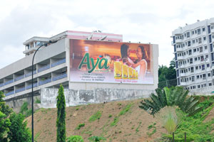 A building advertisement of the Aya vegetable oil reads “Treasure of my country”