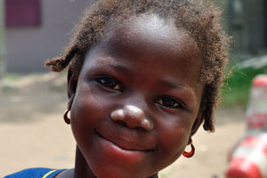 Little african girl smiles at me