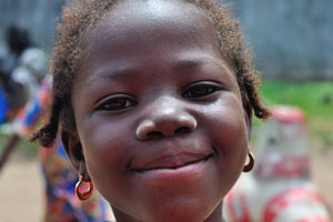 Wide open smile is on the face of little Ivorian girl
