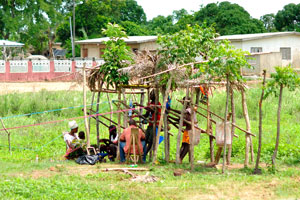 People weaving at loom near Korhogo