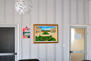 A painting is at the reception of hotel OLYMPE