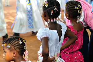 Ivorian children are on the Sunday service in the Cathedral of St. John the Baptist