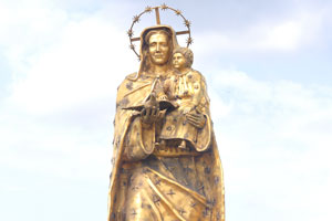 A Virgin Mary statue is located close to the Our Lady of Peace Basilica