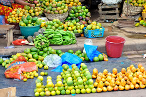Avocados and green bananas are at the market of Le Marché de Mô Faitai