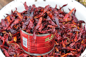 Dried chili pepper pods are for sale at the market of Le Marché de Mô Faitai