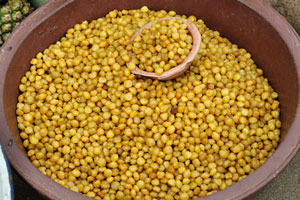 Yellow round seeds are for sale at the market of Le Marché de Mô Faitai