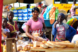 Enchanting female bread vendors are at the bus station of Gare Routiere