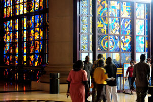 People are in the Basilica of Our Lady of Peace