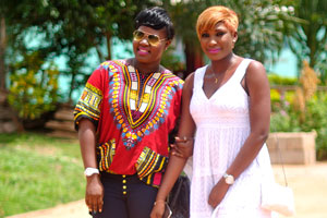 Two lovely Ivorian women wear enjoyable clothes