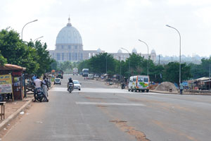 The Basilica of Our Lady of Peace as seen from the street adjacent to the Grand Mosque of Yamoussoukro