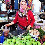 A female vendor of peaches