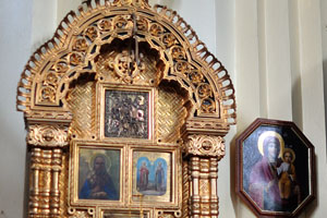 A set of icons is on the wall in the Cathedral of the Theotokos