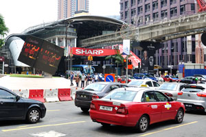 Road traffic at the entrance to the H&M chain retailer