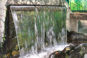 Small man-made waterfall in the park
