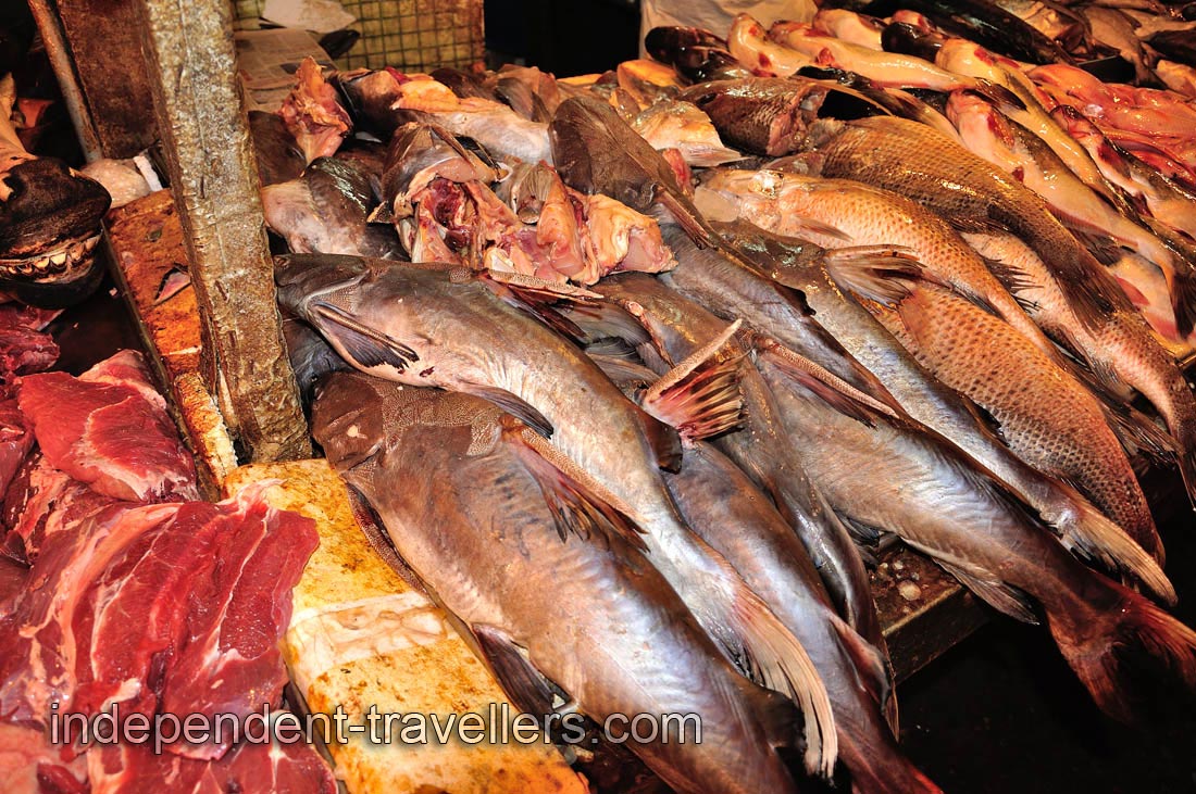 Large specimens of fish and huge pieces of meat for sale