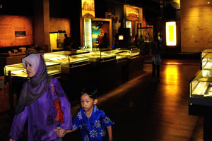 Malaysian mother and her son inside the National museum