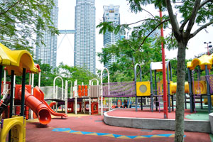 View of Menara Maxis and Petronas Towers from the children's playground