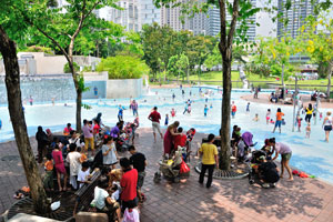 A children's playground with a public pool is located on the west side of the park