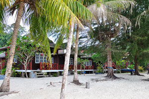 Fauna Beach Chalet cottages are placed on the white sand beach