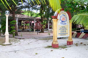 Inscription on the pedestal reads: “Welcome to Flora Bay Resort”
