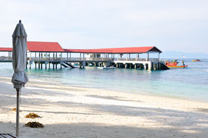 There is a long pier on the Tuna Bay beach