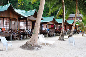 Abdul's Chalets cottages are placed on the white-sand beach