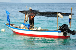 Fisherman and its fishing boat
