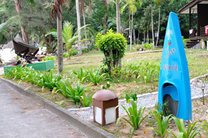 Half of the kayak has been vertically dug into the ground and is the symbol of the PIR garden