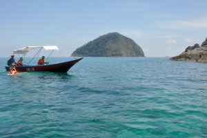 One more motorboat with a snorkeling tourists has arrived on the Serengeh island