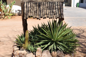 A small ornamental wooden garden well is in the Solitaire Lodge