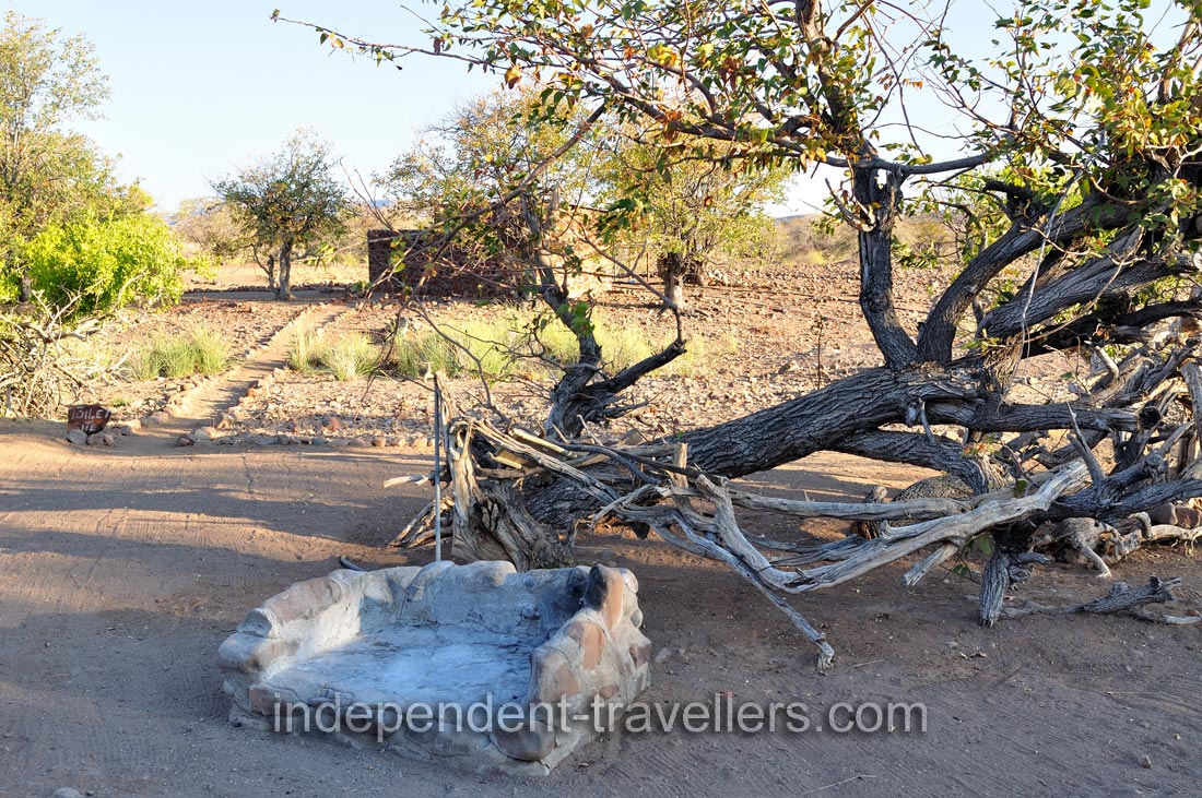 We rented a camping pitch at Palm Camp equipped with a stone fire pit
