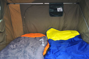 This is the interior of the car roof top tent where I slept at the camping pitch in Palm Camp