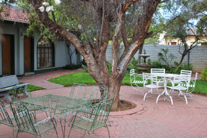 The inner courtyard of the Onze Rust Guest House looks very cozy