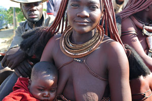 A ravishing Himba woman is at the entrance to the Opuwo State Hospital