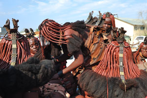 Himba women are at the entrance to the Opuwo State Hospital