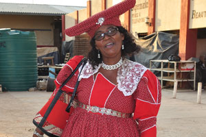 A Herero woman is striking a pose