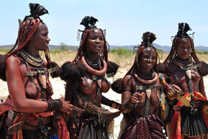 The Himba girls are dressed in the colourful traditional clothing