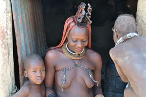 An infant or child Himba have their head kept shaved of hair