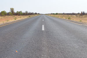 This is C41 road at the following geo coordinates -18.15481, 14.27186, a view towards the town of Oshakati