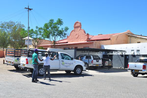 A car with the logo of Octagon Construction Windhoek is parked near Puma Keetmanshoop gas station
