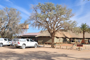 The parking lot of Namibia Wildlife Resorts Sesriem Camping is located beside the house containing the reception
