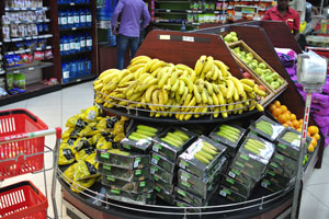 Bananas, pears and oranges are for sale in Spar grocery store