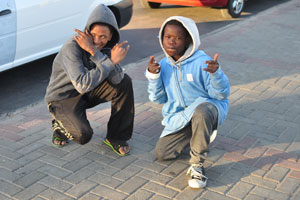 Boys are on the street near Spar grocery store
