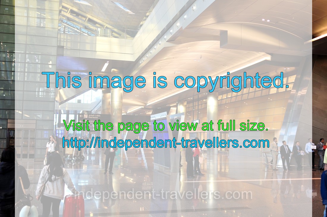 People are in the arrivals hall of Hamad International Airport (IATA: DOH)