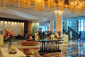 The interior of the reception hall of the Marriott Marquis City Center Doha Hotel is decorated with fresh flowers