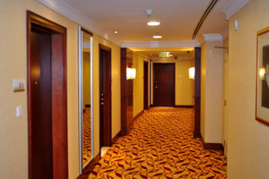 A corridor of the Marriott Marquis City Center Doha Hotel is covered with soft and clean carpet