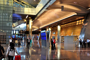 People are in the arrivals hall of Hamad International Airport (IATA: DOH)