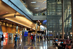 The arrivals hall of Hamad International Airport (IATA: DOH) is decorated with tall artificial palm trees