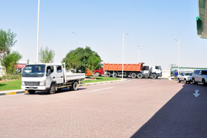 Vehicles are lined-up for gas on “WOQOD Petrol Station #18, Rawdat Al Hamama” gas station