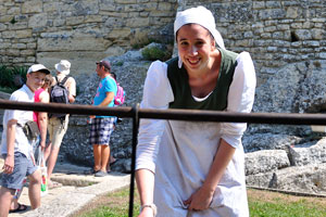 One of the theater actresses in the Guaita fortress is smiling widely